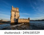 Belem Tower or Tower of St Vincent - famous tourist landmark of Lisboa and tourism attraction - on the bank of the Tagus River Tejo on sunset. Lisbon, Portugal