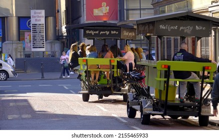 Belfast Party Bike In The City Center - BELFAST, UNITED KINGDOM - APRIL 25, 2022