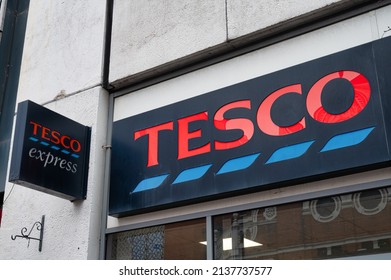 Belfast, UK- Feb 19, 2022: The sign for Tesco Express  in Belfast Northern Ireland.