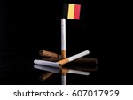Belgian flag with cigarettes and cigars. Tobacco Industry concept.