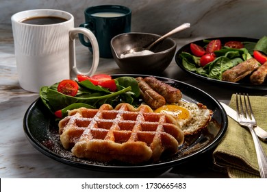 Belgian Waffle Breakfast Served With Sausage Eggs And Coffee