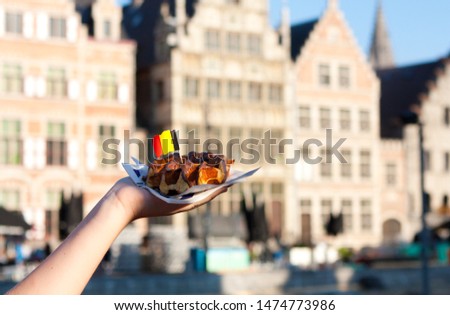 Belgian waffle with chocolate sauce.