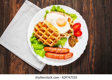 Belgian Waffle With Egg And Sausage On Wood Table.