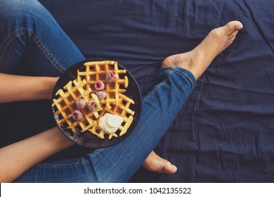 Belgian Waffles With Cream And Frozen Raspberries On Blue Ceramic Plate In Woman' S Hands. Top View. Toned