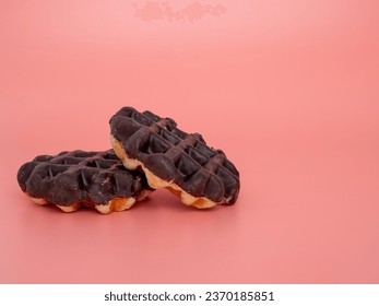 Belgian waffles on a pink background. Belgian waffles close up. - Shutterstock ID 2370185851