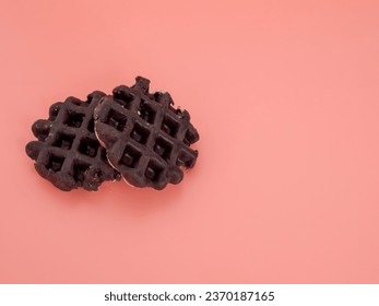 Belgian waffles on a pink background. Belgian waffles close up. - Shutterstock ID 2370187165