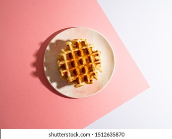 Belgian Waffles Top View On Color Block Background Pink And White