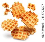 Belgian waffles and waffle pieces levitating in air on white background.