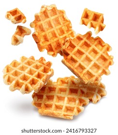 Belgian waffles and waffle pieces levitating in air on white background.