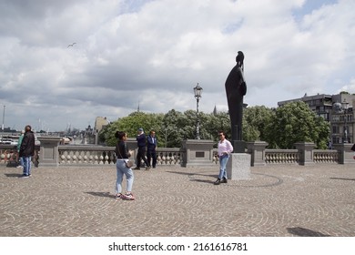 Belgium, Antwerp, May 26, 2022. The elevated Zuiderterras near the river Scheldt (Schelde) with the Minerva statue and photographing tourists. Spring in the city of Antwerp.