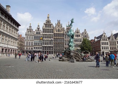 Belgium, Antwerp, May 26, 2022. Grote Markt square with old guild houses. Fountain with statue Brabo fountain. Stepped gables, tourists. Center of the Belgian city of Antwerp.                         