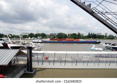 Belgium, Antwerp, May 26, 2022. Maersk Line container ship, cuise ships, crane in the River Scheldt (Schelde) in the Belgian city of Antwerp. Spring.                               