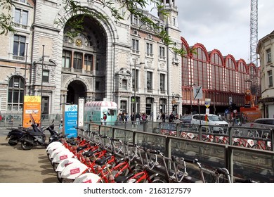 Belgium, Antwerp, May 26, 2022. Outside of the historical Antwerp Central Trainstation seen from street Keyserlei. City bikes from Velo. Ice cream foodtruck, truck,                                 
