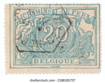 BELGIUM - CIRCA 1882: An Old Canceled Blue 20 Centime Railway Official Stamp. Numerals In Frame With Steam Locomotive And Ornament