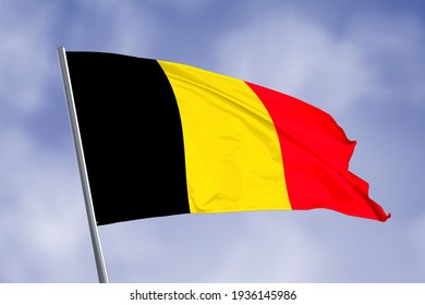 Belgium flag isolated on sky background. close up waving flag of Belgium. flag symbols of Belgium.