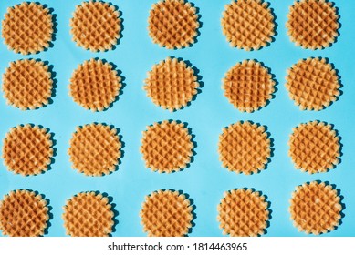 Belgium style homemade waffle dessert on blue background pattern flat lay