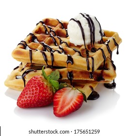 Belgium waffles with chocolate sauce, ice cream and strawberries isolated on white background