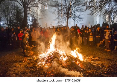 BELGRADE - JANUARY 6: People Watch A Ceremonial Burning Of Dried Oak Branches - The Yule Log Symbol For The Orthodox Christmas Eve In Front Of St. Sava Church On January 6, 2014 In Belgrade, Serbia.