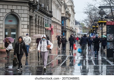 BELGRADE, SERBIA - APRIL 17, 2021: Selective Blur On Two Girls, Friends, Walking With A Sports Suit And A Basket Ball Wearing A Face Mask In Kneza Mihailova Street Of Belgrade, On  Coronavirus Covid 