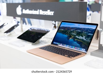 Belgrade, Serbia - February 15, 2022: New Apple MacBook Air Laptop Is Shown On Retail Display In Electronic Store. Brand Logo In The Background.