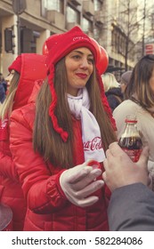 BELGRADE, SERBIA - JANUARY 01, 2017: Coca-Cola Promo Girl, Handing Out Free Sample Of Coke. Vintage Style.