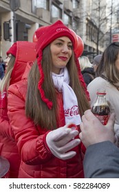 BELGRADE, SERBIA - JANUARY 01, 2017: Coca-Cola Promo Girl, Handing Out Free Sample Of Coke.