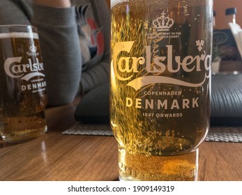 BELGRADE, SERBIA - JANUARY 16, 2020: Logo of Carlsberg on a beer glass with its distinctive visual. Carlsberg is a Danish light pilsner beer produced in Copenhagen, and a global brewer.


