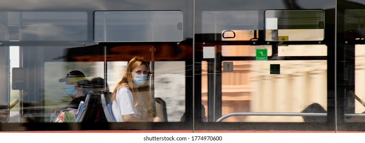 Belgrade, Serbia - July 4, 2020: One Teen Woman Wearing Face Surgical Mask Riding On Window Seat Of A Public Transportation Bus