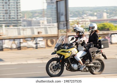 Belgrade, Serbia - June 5, 2021: Young Woman Riding A Motorbike With A Pillion Passenger Girl , On City Street On A Sunny Day