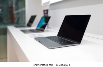 Belgrade, Serbia - March 21, 2018: New Laptop With Blank Black Screen On White Table In Electronic Store. MacBook Pro With Retina Display, Three In Line.