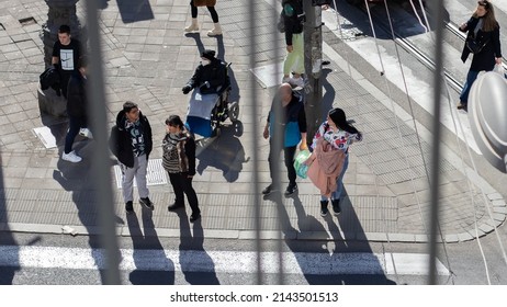 Belgrade, Serbia - March 23rd 2022: Top View Of The Intersection. People Are Waiting To Cross The Street As Well As Women In Wheelchair. 