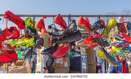 Belgrade, Serbia - March 26, 2022: Colourful Cleats Soccer Football Sports Shoes Hanging By Laces At Flea Market.