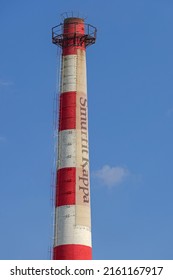 Belgrade, Serbia - May 14, 2022: Tall Chimney Smurfit Kappa At Paper Factory Building.