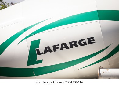 BELGRADE, SERBIA - MAY 22, 2021: Logo Of Lafarge Ciments On A Concrete Mixer Truck On Road. Lafarge Is The Old Name Of LafargeHolcim, A Concrete, Construction Aggregate And Building Materials Company.



