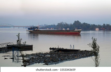 Belgrade, Serbia - October 2014: Big barge on polluted river