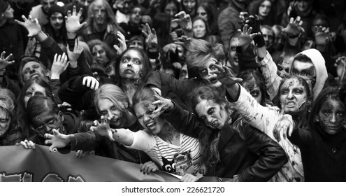 Belgrade, Serbia - October 26, 2013: People dressed as a zombie parades on a street during a zombie walk in Belgrade, The zombie walk is part of the events of a upcoming Serbian SF movie festival
