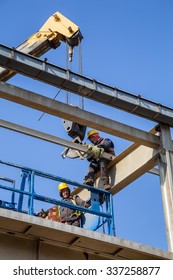 BELGRADE, SERBIA - OCTOBER 28, 2015: Workers In Cherry Picker On Site, High Above Dissembling Metal Structure.