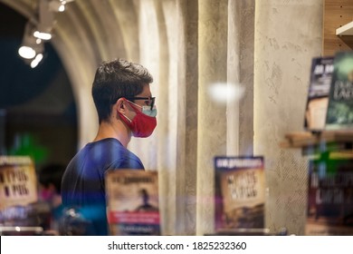 BELGRADE, SERBIA - SEPTEMBER 15, 2020: Client, Young Man, In A Bookstore Standing Wearing Two Respiratory Face Masks Instead Of One In Belgrade, During The Coronavirus Covid 19 Health Crisis.

