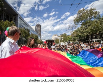 BELGRADE, SERBIA - SEPTEMBER 17, 2017: Selective Blur On A Crowd Of Protestors Holding A Giant Rainbow Gay Flag During Belgrade Gay Pride 2017 Called Beograd Prajd. The Parade Happened Without Trouble