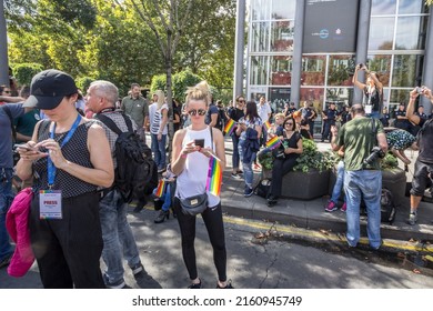 BELGRADE, SERBIA - SEPTEMBER 17, 2017: Selective Blur On Girls And Women Holding Smartphones And Rainbow Gay Flag During Belgrade Gay Pride. The Rainbow Flag Is One Of The Symbols Of LGBTQ Community