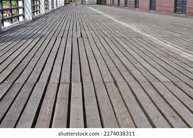 Belian wood is used as the floor of a building - Shutterstock ID 2274038311