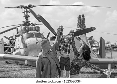 I Believe I Can Fly. Family Couple With Son On Vacation Travel. Woman And Man With Boy Child At Helicopter. Air Tour And Travel. Enjoying Travelling By Air. Happy Family Vacation.