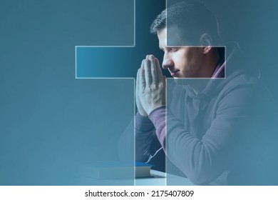 Believing Christian. Man prays to God. Christian crucifix in front of praying man. Catholic guy with closed eyes. Christian in pose of prayer. Concept of study of Catholic religion. Appeal to God