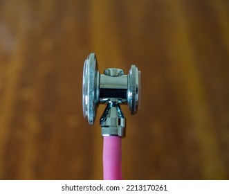 Bell And Chest Piece Of A Pink Coloured Double Tube Stethoscope 