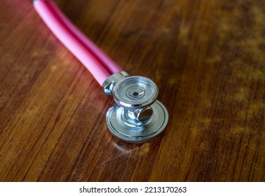 Bell And Chest Piece Of A Pink Coloured Double Tube Stethoscope 