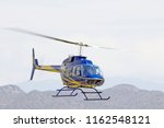 Bell Jet ranger 409 Helicopter Blue Aviation with Mountain Background