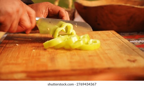 bell pepper involves removing the top and bottom, then cutting down one side to flatten it, allowing for easy, mess-free slicing into strips or cubes