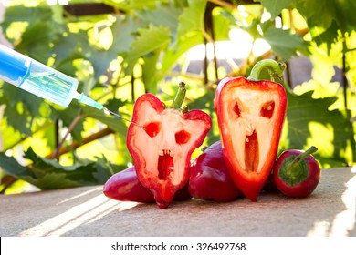 Bell Pepper Next To A Syringe Against, Gmo Food Concept