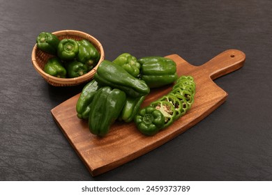 Bell peppers on a cutting board - Powered by Shutterstock