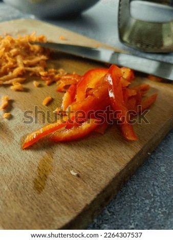 Bell peppers on a wooden board close up. Preparation braised carnage 
